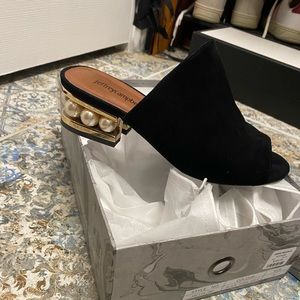 Jeffrey Campbell black suede mule with gold and pearl heel.